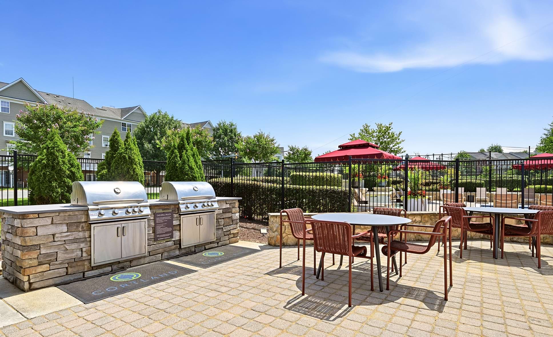 Gas Grills with Tables and Chairs Nearby at Our Apartments in Herndon, VA