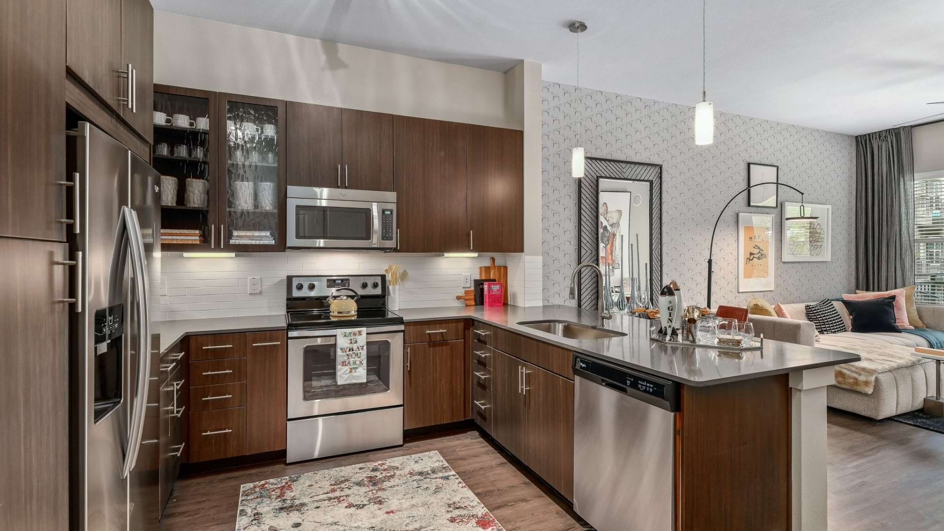 Modern apartment kitchen with stainless steel appliances 