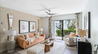 Living Room with Private Patio Access at Our Apartments For Rent in The Hammocks