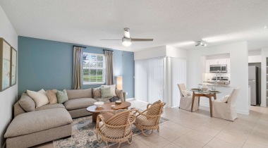 Open-Concept Living Room with a Ceiling Fan at Our Apartments for Rent in Pembroke Pines