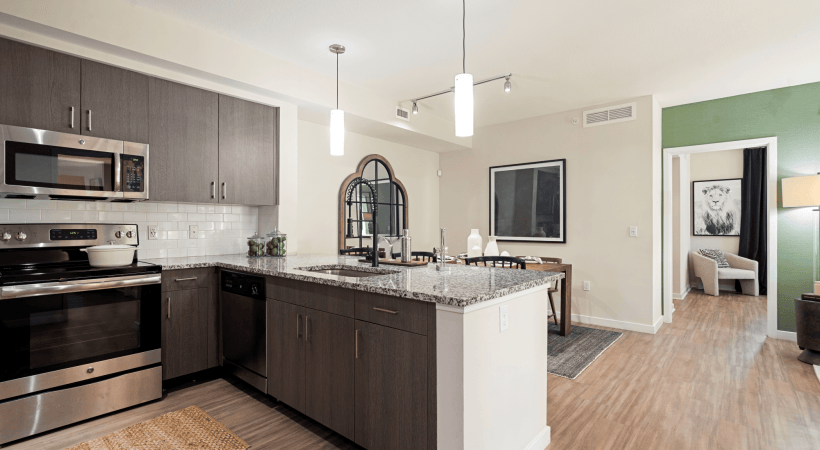 Kitchen and Dining Area with Wood-Style Flooring at Our Apartments for Rent in Hollywood, FL