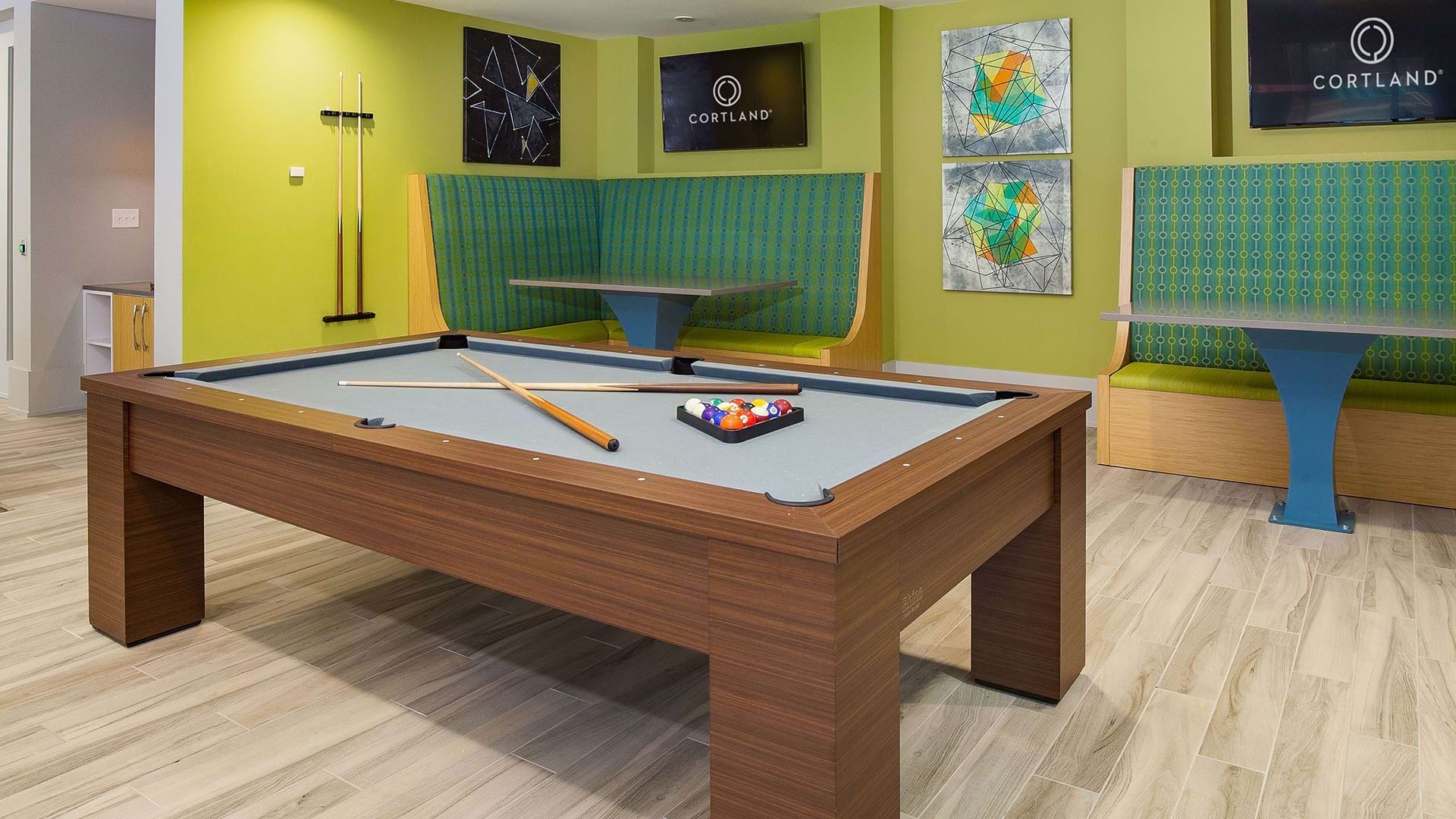 Pool table and lounge areas at our Lake Village East apartment clubhouse