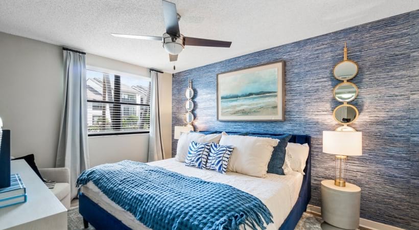 Bedroom with Wood-Style Flooring at Our Apartments on 104th