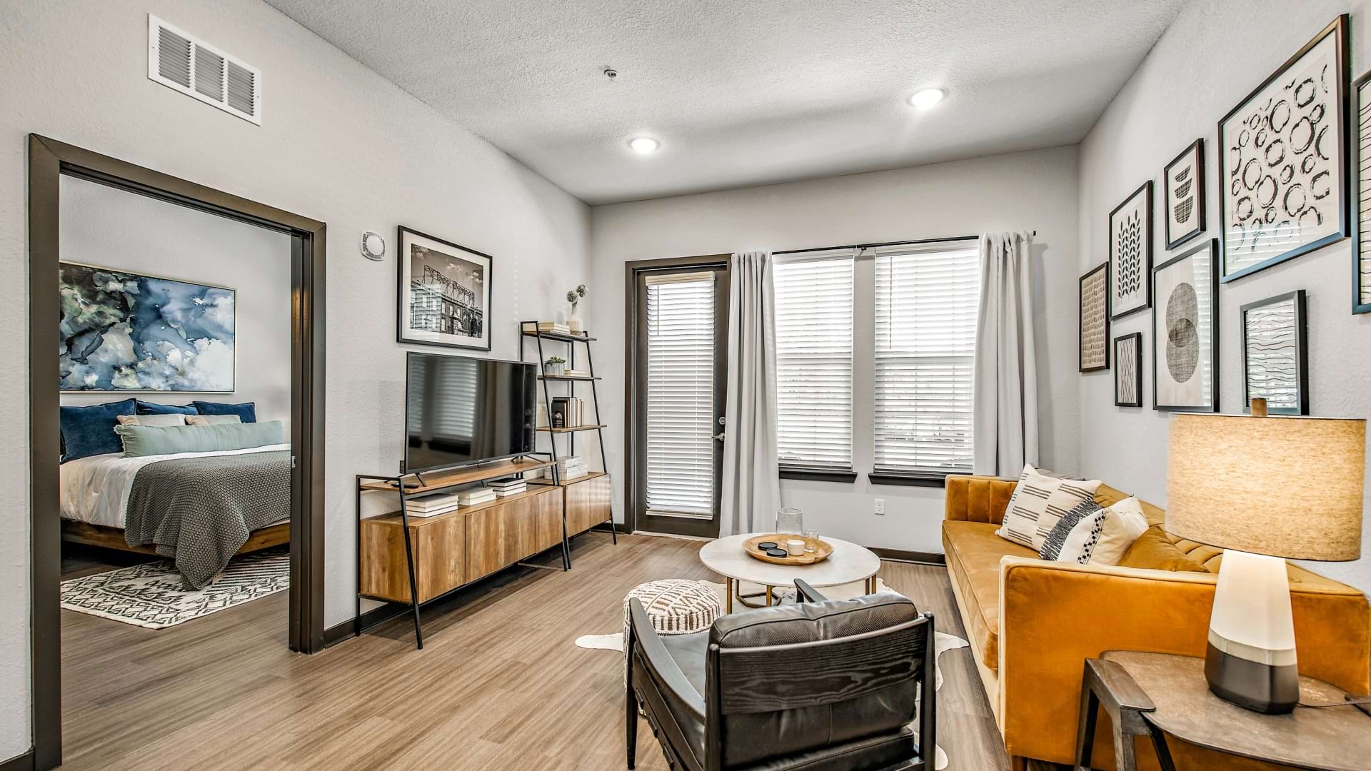 Well-Lit Living Room with Wood-Style Flooring at Our Brandon Apartments in FL