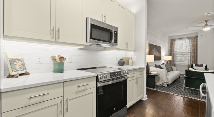 Large Kitchen with Custom Cabinetry-Under-Cabinet Lighting & Tile Backsplashes at Our Lindbergh, GA Apartment Community