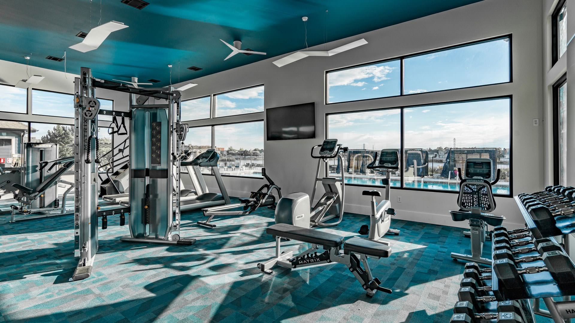 Fitness Center with City Views at Our Gateway Apartments Near Denver International Airport