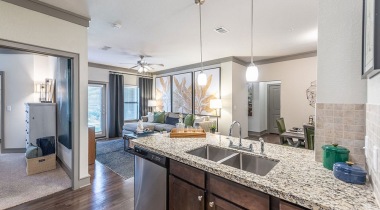 Luxury Open-Concept Floor Plan With Granite Countertops And Modern Lighting At Our Apartments For Rent In Cinco Ranch - Katy, TX