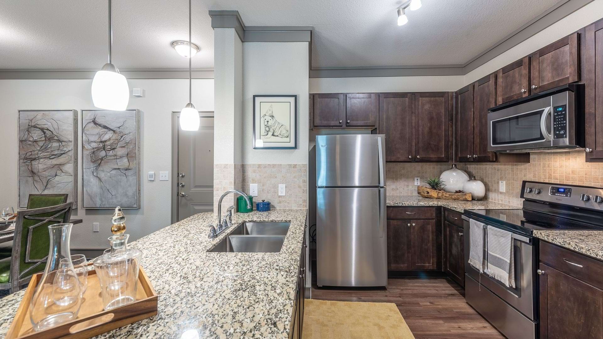 Luxury Kitchen With Modern Cabinetry And Granite Countertops At Our Apartments In Katy, TX