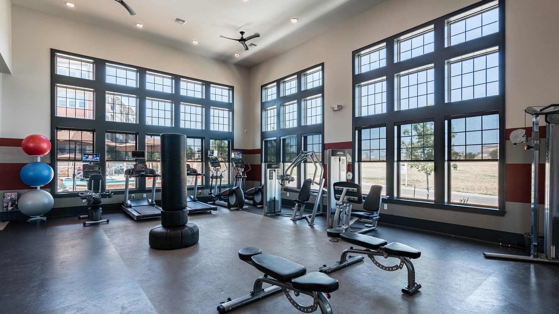 Our Broomfield Apartment Gym With Bright Natural Lighting and Updated Fitness Equipment