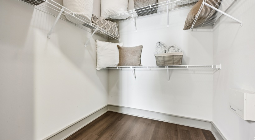 Walk-in Closet with Decorative Pillows in Our Midtown Raleigh Apartments