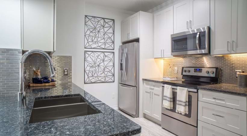 Kitchen with Sleek Countertops in Our Spacious Apartments on Hebron Pkwy.