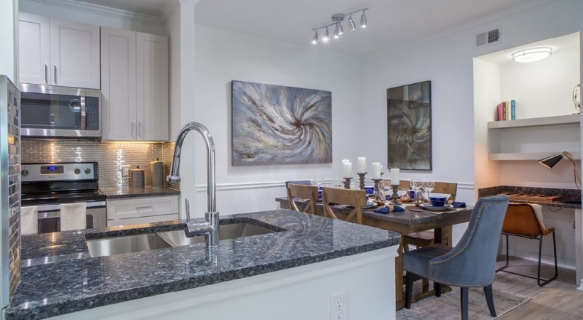 Open Kitchen, Dining Area, and Built-in Desk in Our Hebron Pkwy. Apartments