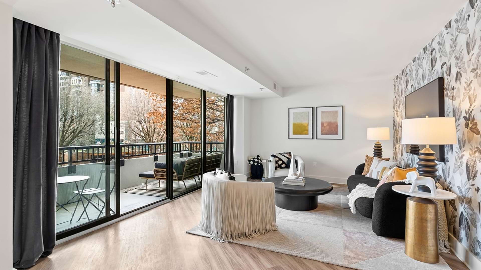 Living Room with Floor to Ceiling Windows and a Private Balconies at Our Clarendon Apartments