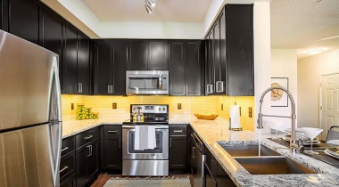 Upscale Kitchen with Stainless Steel Appliances and Granite Countertops at Our Southpoint Apartments in Durham