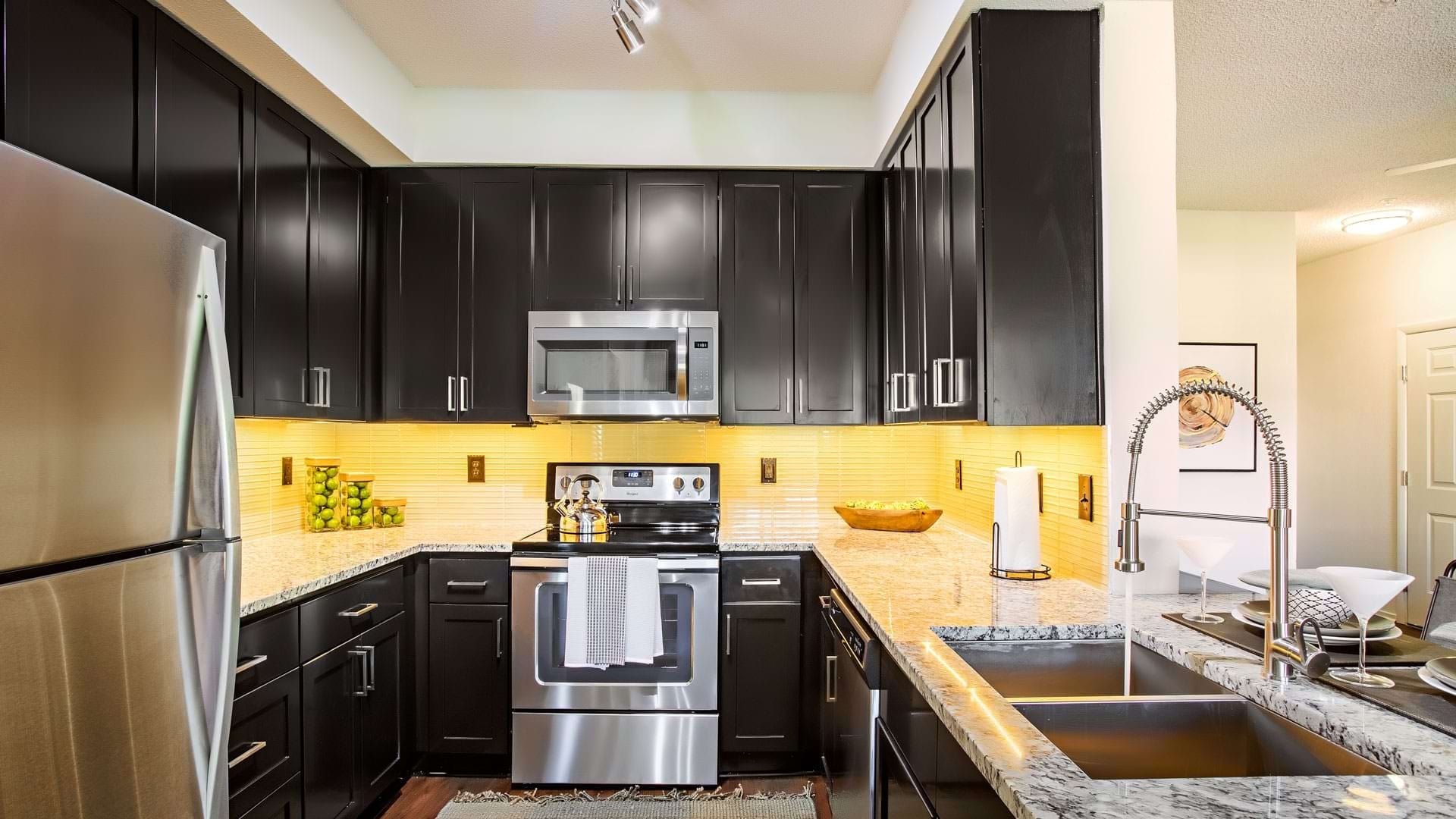 Modern Kitchen Cabinetry with Under Cabinet Lighting at Our Apartments for Rent in Durham, NC