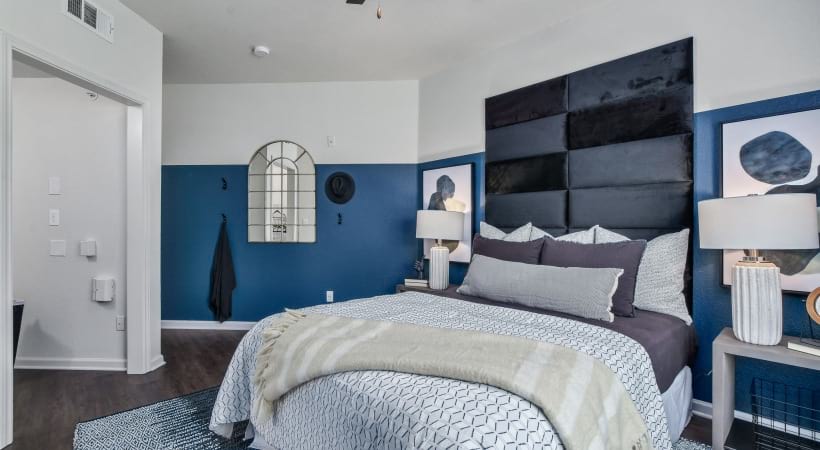 Bedroom with an Accent Wall in Our Apartments Near Watters Creek in Allen, TX