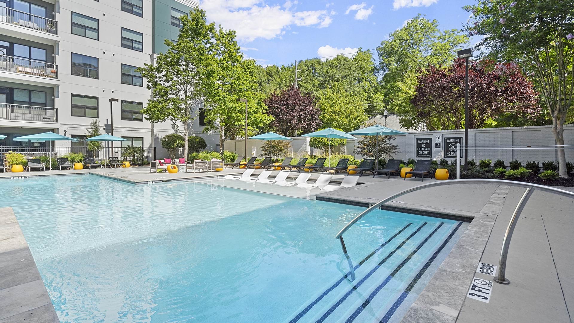 Pool with Lounge Chairs at Our North Decatur Apartments