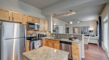 Modern Apartments With Kitchen Island And Granite Countertops At Our Apartments Near Lake Travis