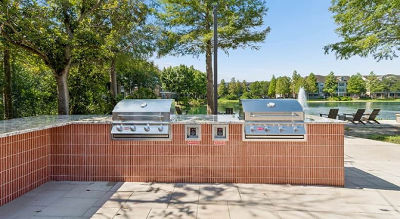Newly Renovated Outdoor Kitchen with Gas Grills at Cortland Lakecrest