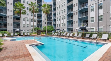 Resort-Style Pool with Lounge Chairs at Our Uptown Altamonte Springs Apartment Community