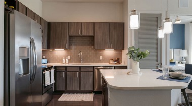 Spacious Kitchen With Granite Island And Modern Cabinetry At Our Luxury Apartments In Allen, TX