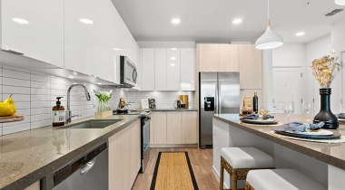 Modern Kitchen with Island and Stainless Steel Appliances at Our Gateway Apartments 