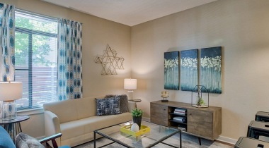 Living Room with Wood-Style Flooring at Our Wadsworth Apartments