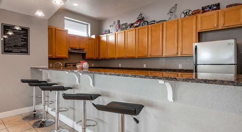 Resident Clubhouse Kitchen with Barstools at Our Beachside Apartments in Daytona
