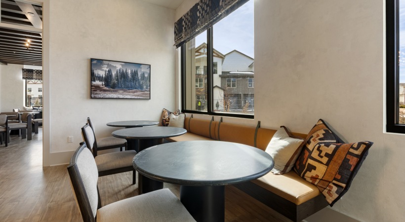 Resident Clubhouse with Cozy Lounge Areas and Tables at Our Luxury Colorado Springs Apartments