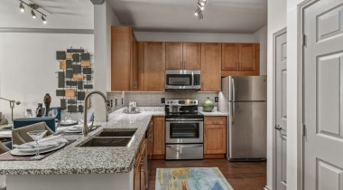 Kitchen with stainless steel appliances at our modern apartments in the Colony, TX
