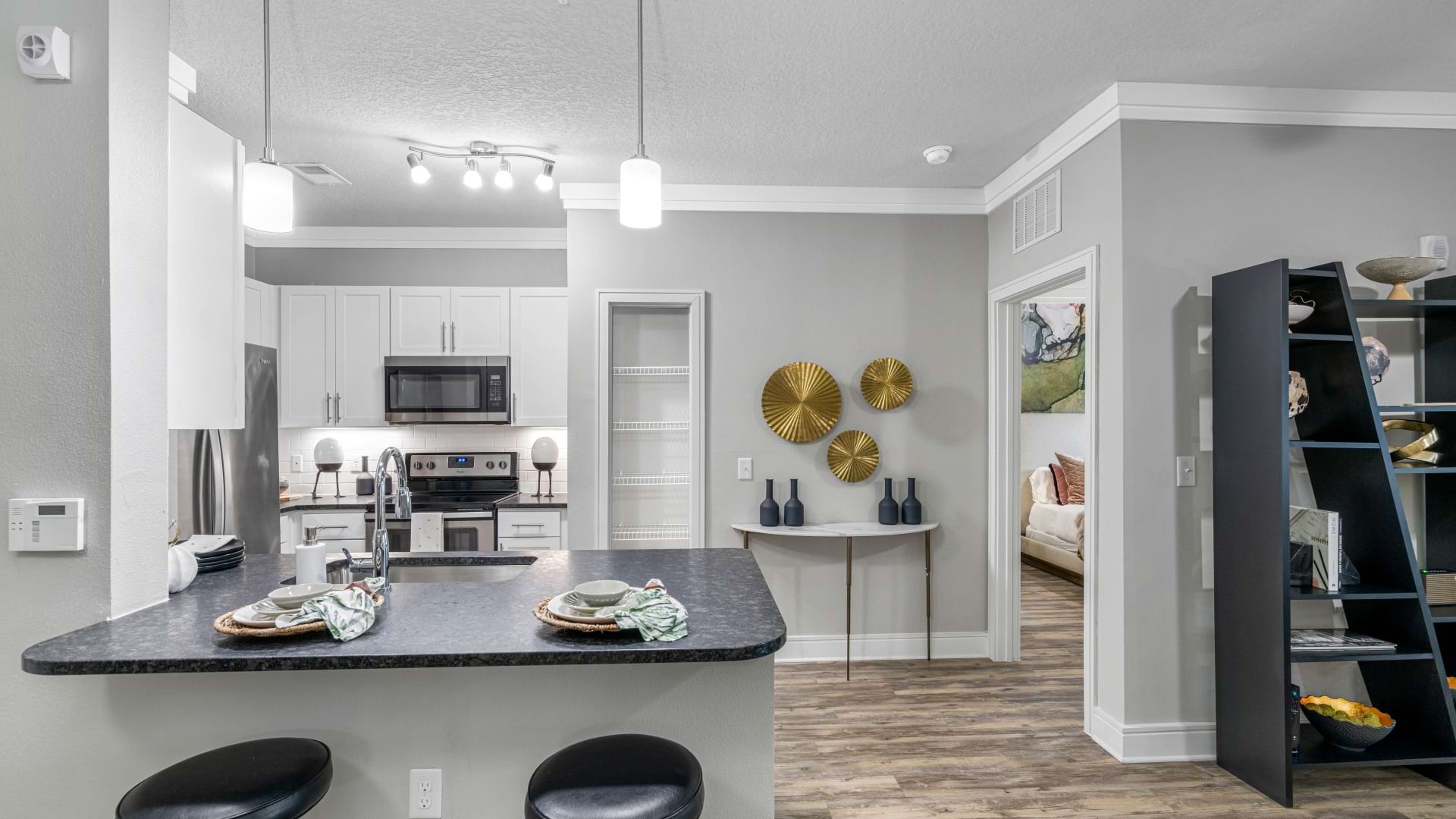 Luxury apartment kitchen with stainless steel appliances 