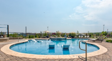 Resort-style pool with loungers at our Broomfield apartments for rent