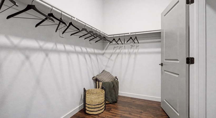Spacious Walk-In Closets with Wood-Style Flooring at Our Apartments Near Peterson AFB in CO