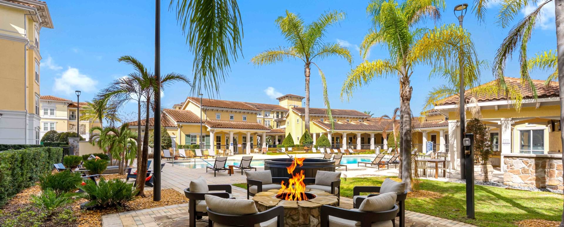 Outdoor Lounge with Fire Pit at Our Apartments  in Kissimmee, FL