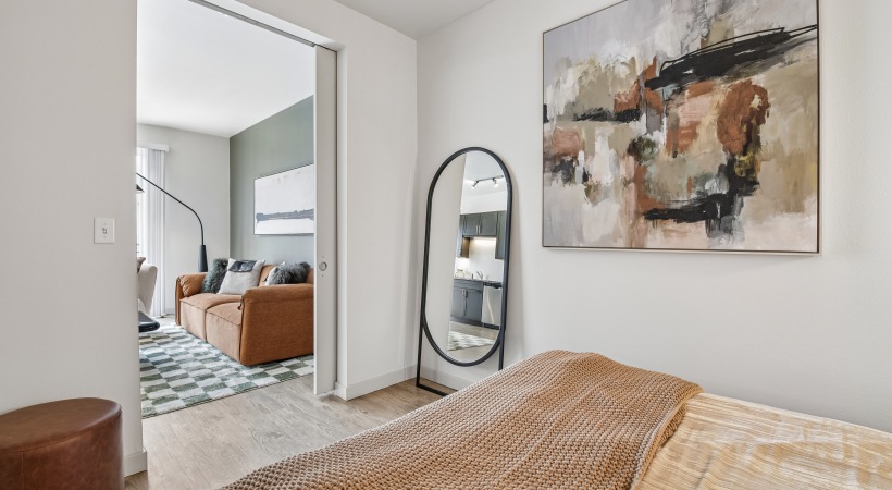 Modern Bedroom with Wood-Style Flooring at Our Apartments on Alameda