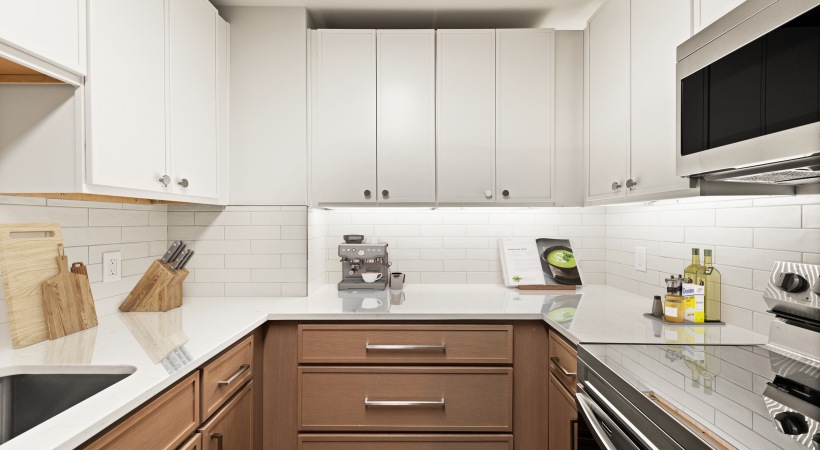 Modern Cabinetry with Designer Hardware and Tile Backsplashes