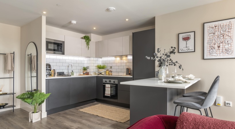 Kitchen with Wood-Style Flooring at Our Broad Street Apartments in Birmingham