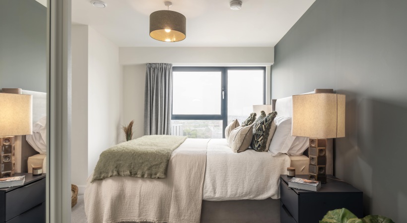 Bedroom with Floor-to-Ceiling Windows at Our Westside Birmingham Apartments