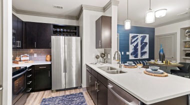 Kitchen with stainless steel appliances at our upscale apartments for rent in Frisco, TX