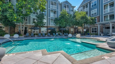 Resort-Style Pool with Cabanas at Our City Park Apartments