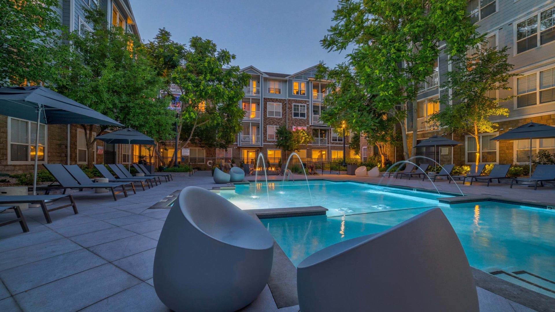 Resort-Style Pool with Lounge Chairs at Our Apartments in Congress Park