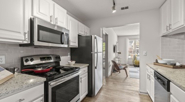 Kitchen with Energy-Efficient, Stainless Steel Appliances at Our Glenridge Apartments Near Atlanta 