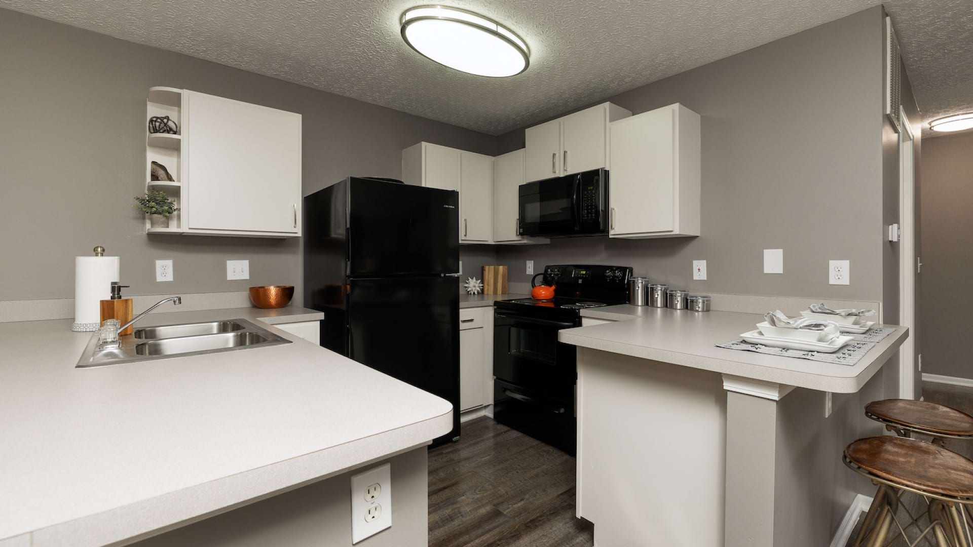 Kitchen with Energy-Efficient, Black Appliances at Our Apartments in Pickerington