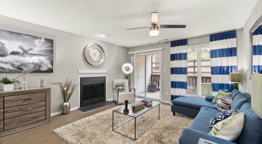 Modern Living Room Space with Gas Fireplace at Our Apartments in Sandy Springs, GA