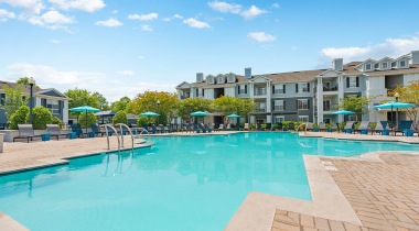 Sparkling Resort-Style Pool and Lounge Chairs at Our Apartments at Brier Creek