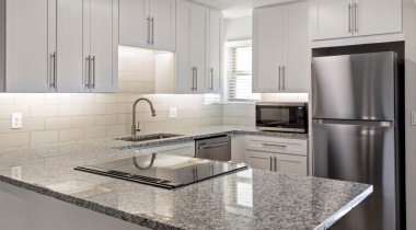 Kitchen with Custom Cabinetry and Designer Hardware at Our Apartments in 85704