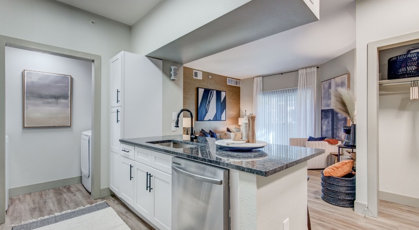 Kitchen with In-Home, Full-Size Washer and Dryer Set Nearby at Our Apartments in Northglenn