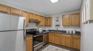 Custom Wooden Cabinetry and Stainless Steel Appliances at Our Ormond Beach Apartments for Rent