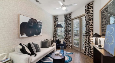 Luxury apartment living room with ceiling fans at our apartments in Farmers Branch