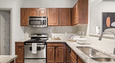 Kitchen with Granite Countertops at Our Apartments By Perimeter Mall